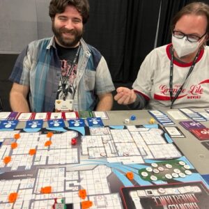 Getting ready to roll the dice while playing Haunted Inheritance at Gamehole Con in Madison, WI.